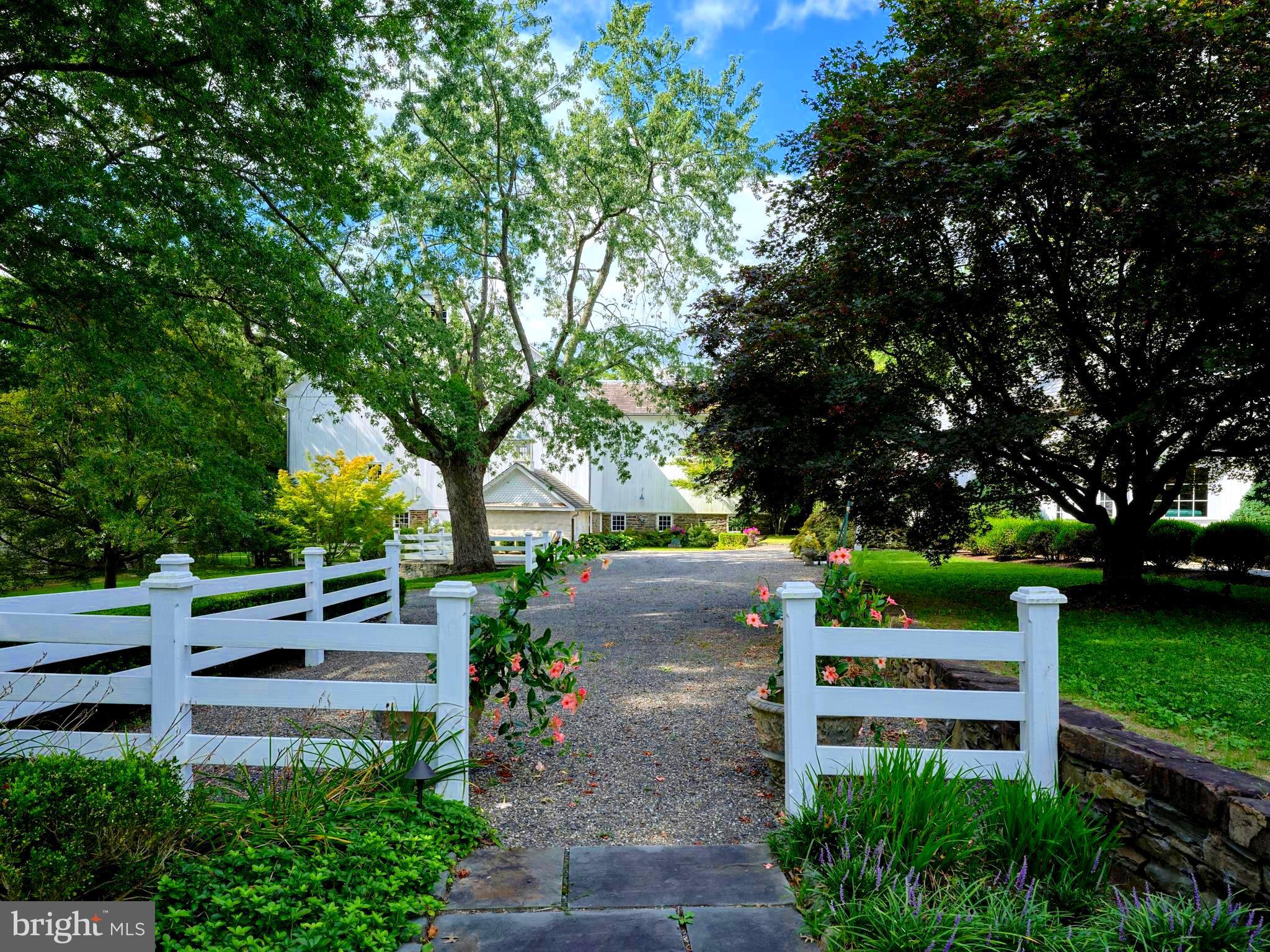 5382 Wismer Road Pipersville, PA 18947 - Photo 38 of 67 a view of a garden with plants and large trees