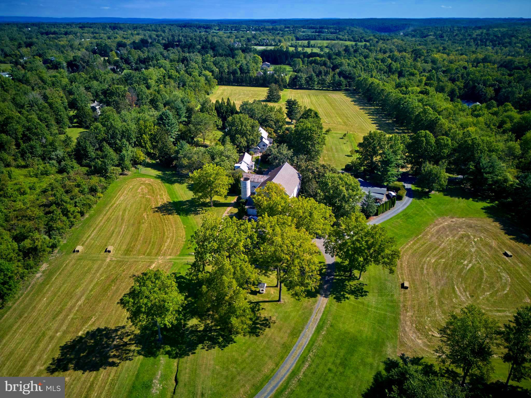5382 Wismer Road Pipersville, PA 18947 - Photo 57 of 67 an aerial view of a residential houses with outdoor space and trees