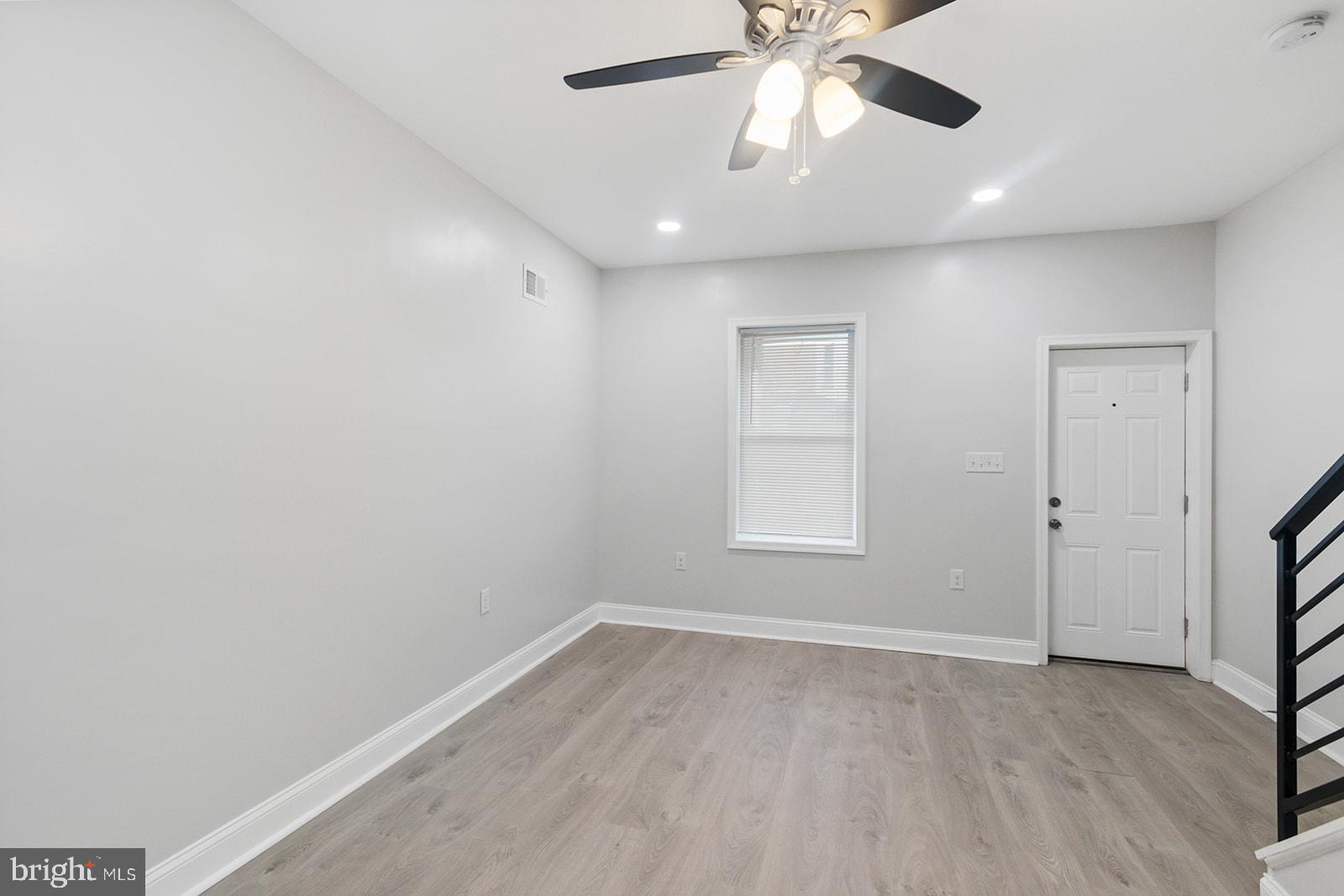 5213 Rodman Street Philadelphia, PA 19143 - Photo 8 of 31 wooden floor in an empty room with a window