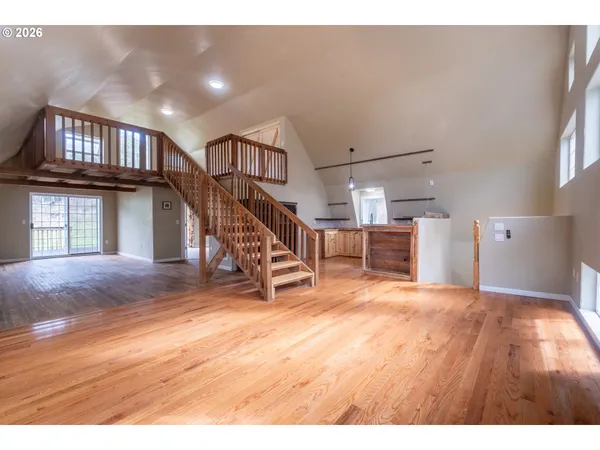 a kitchen with granite countertop a sink cabinets and stainless steel appliances