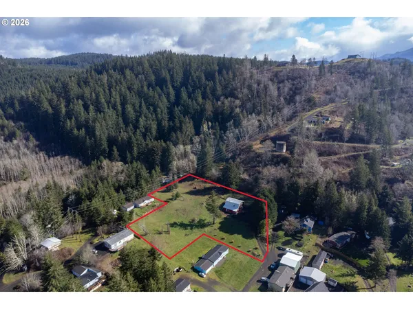 a view of a wooden deck and a yard