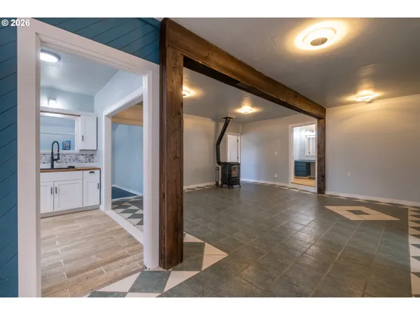 a view of an empty room and glass door