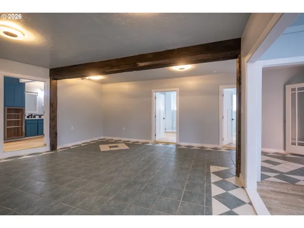 a view of an empty room and a window