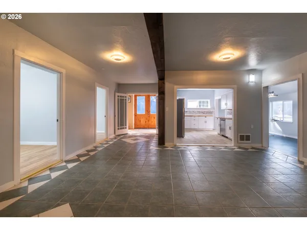 a kitchen with stainless steel appliances granite countertop a sink a stove and refrigerator