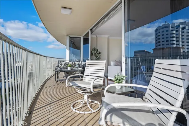 a view of a balcony and chairs
