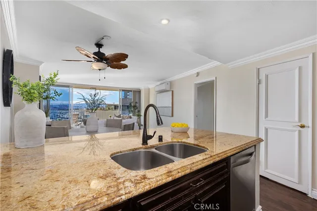 a kitchen with a sink a counter space and a window