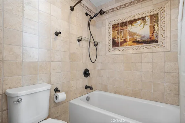 a bathroom with a tub and a shower