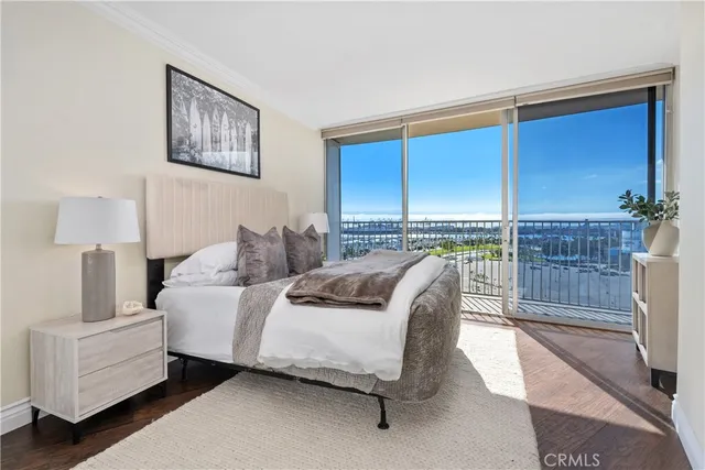 a bedroom with a bed and a night stand