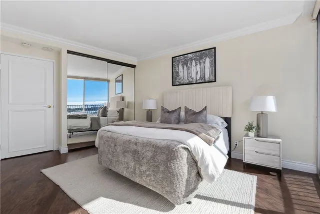 a bedroom with a bed and a lamp