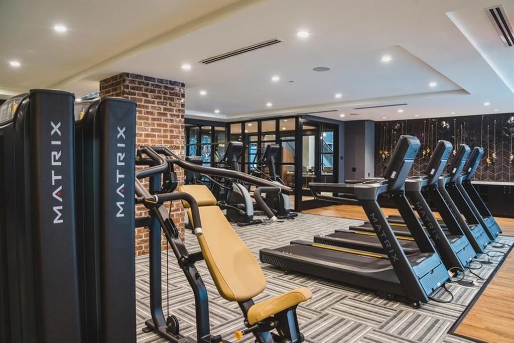 3651 Lenox Road Northeast, Unit B01 Atlanta, GA 30305 - Photo 22 of 28 a view of a room with gym equipment