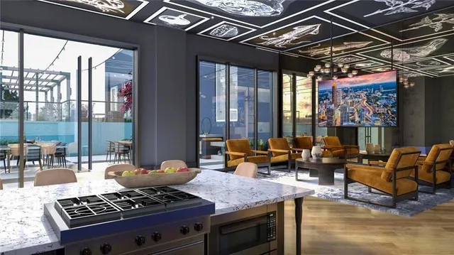 a living room with furniture a chandelier and pool table