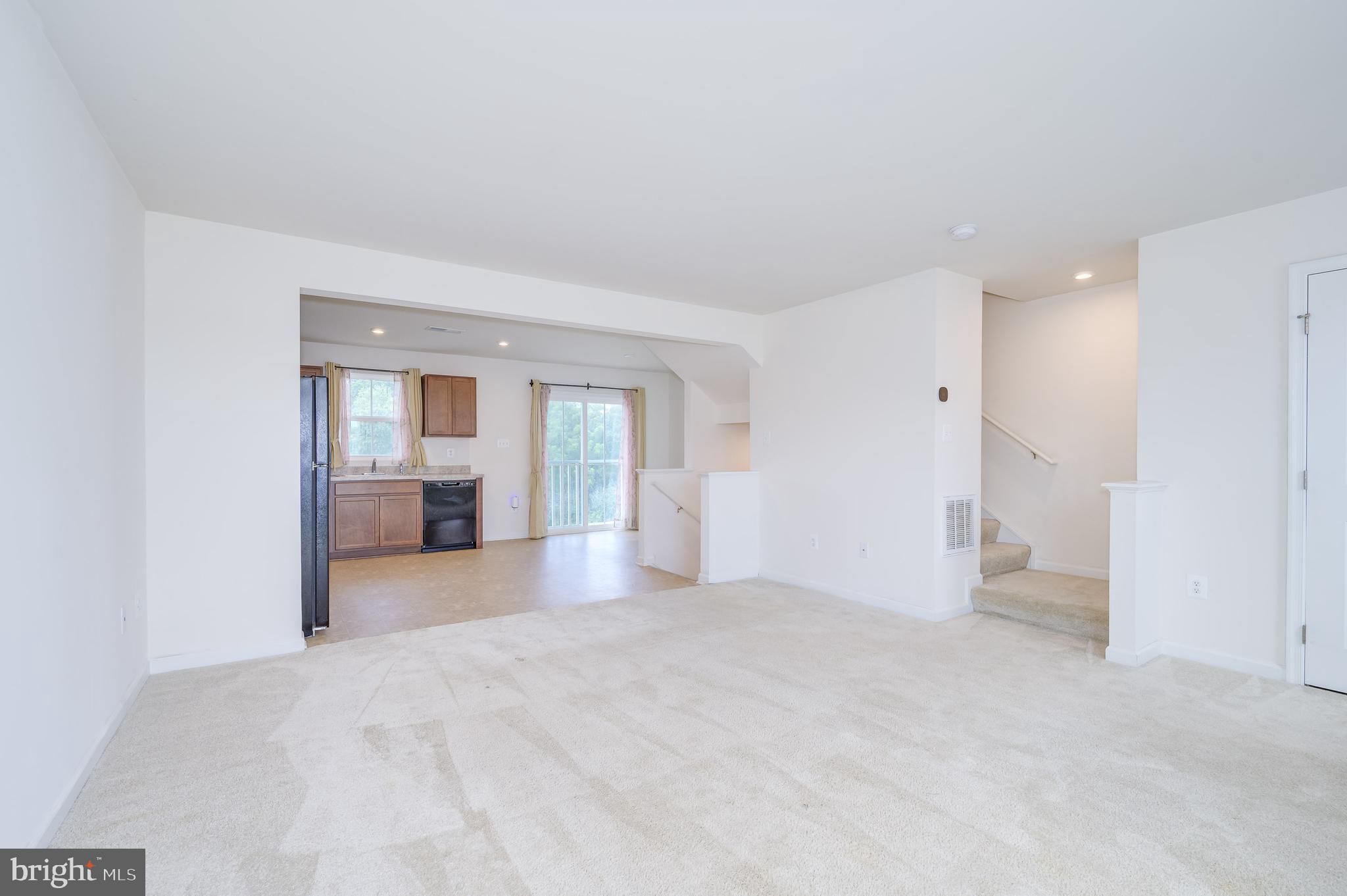 387 Bait Road Inwood, WV 25428 - Photo 11 of 41 Main living-level family room open to kitchen