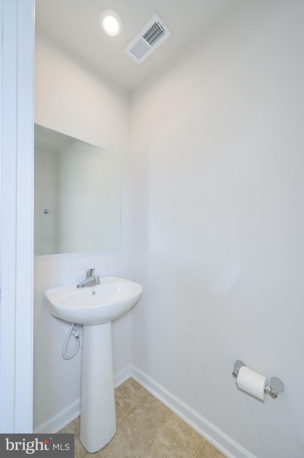 387 Bait Road Inwood, WV 25428 - Photo 20 of 41 Main living level half bath
