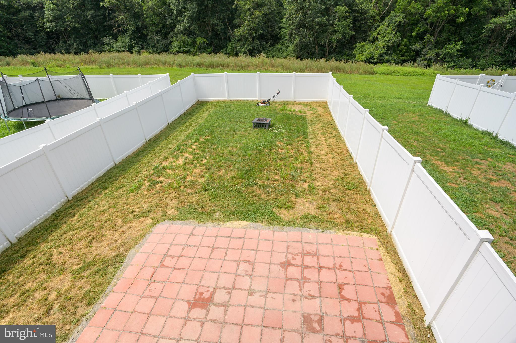 387 Bait Road Inwood, WV 25428 - Photo 37 of 41 Rear vinyl private fence and patio