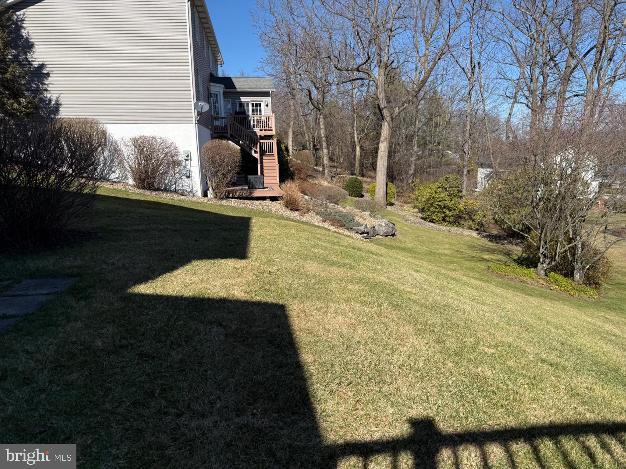 411 Ridge Avenue Altoona, PA 16602 - Photo 38 of 38 Sunny backyard with lush greenery.