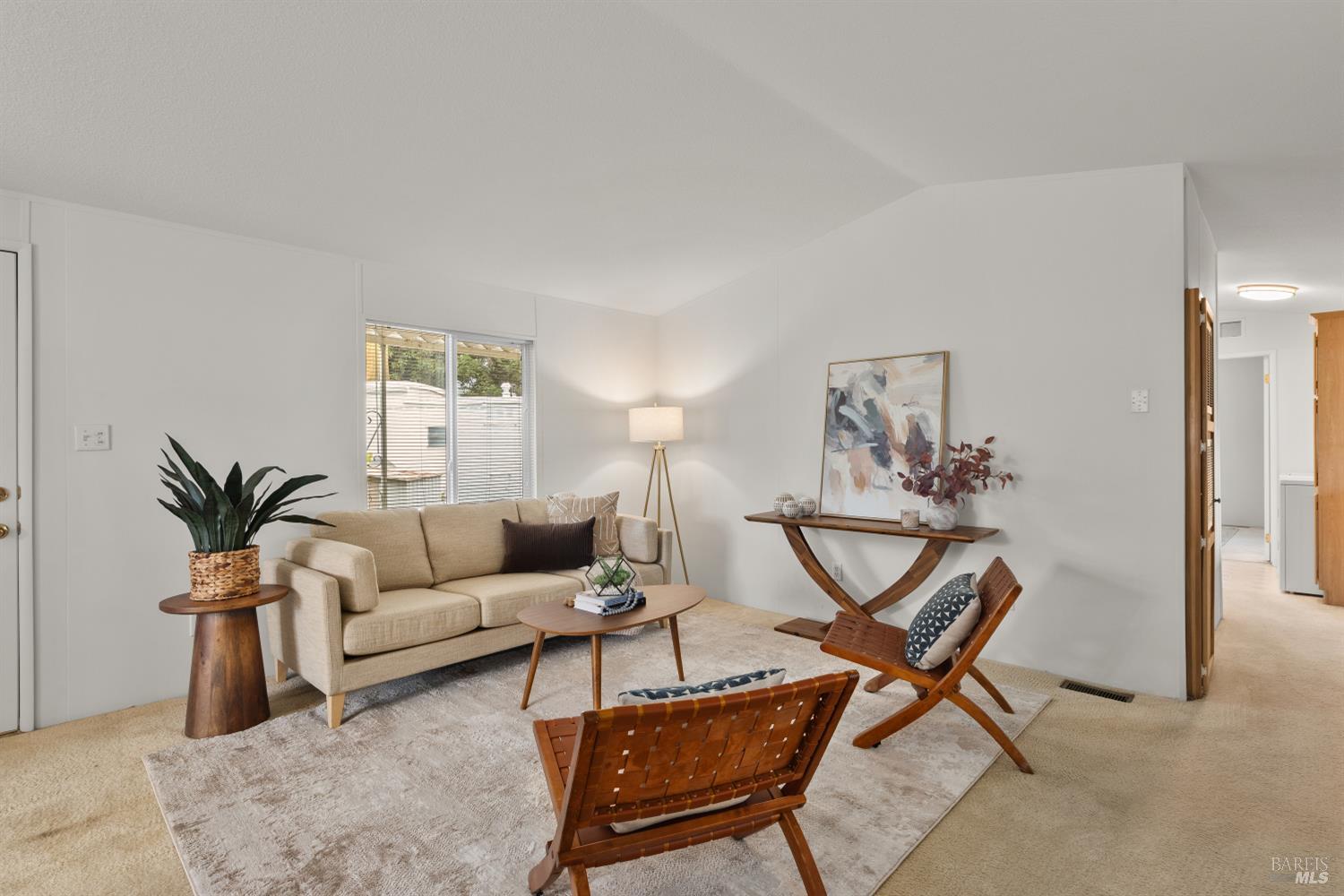 5754 Lois Avenue Santa Rosa, CA 95403 - Photo 6 of 23 a living room with furniture and a potted plant