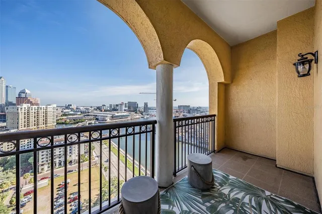 a view of a balcony with two chairs