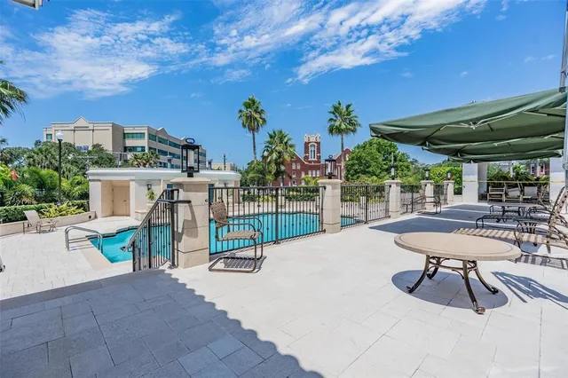 a view of a chairs and table in patio