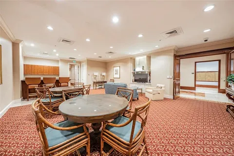 an open kitchen with a table and chairs