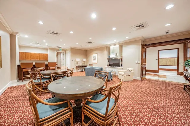 an open kitchen with a table and chairs