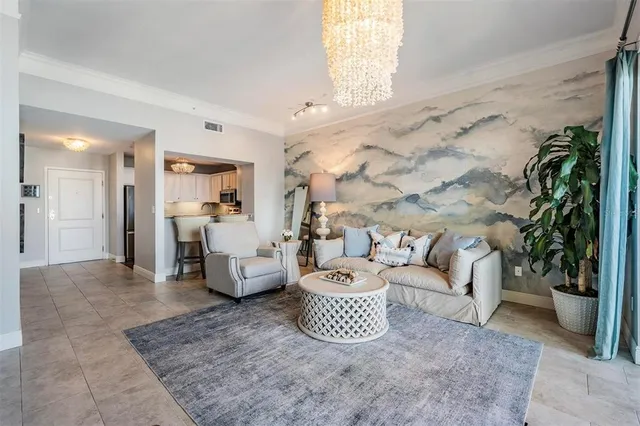 a living room with furniture and a potted plant