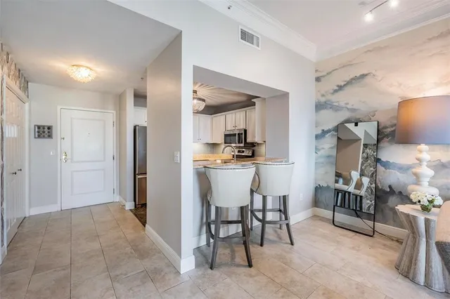 a kitchen with stainless steel appliances a refrigerator and a stove
