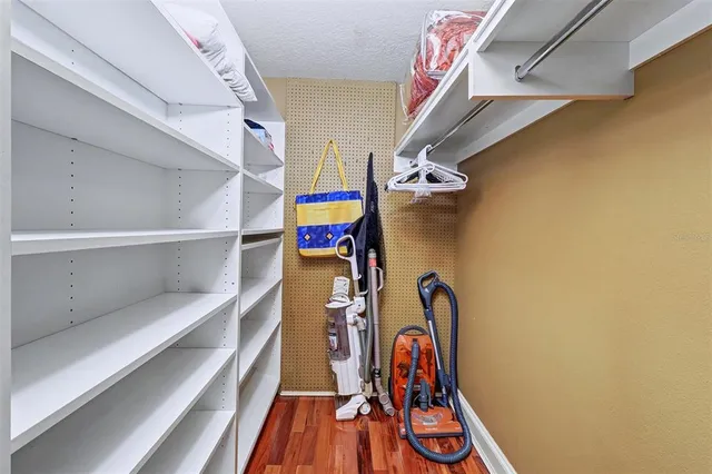 a bed room with a bed and a chandelier