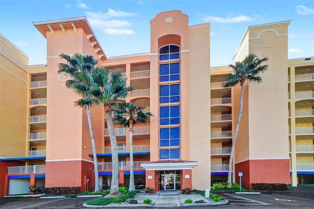 a view of a hallway to a livingroom with furniture
