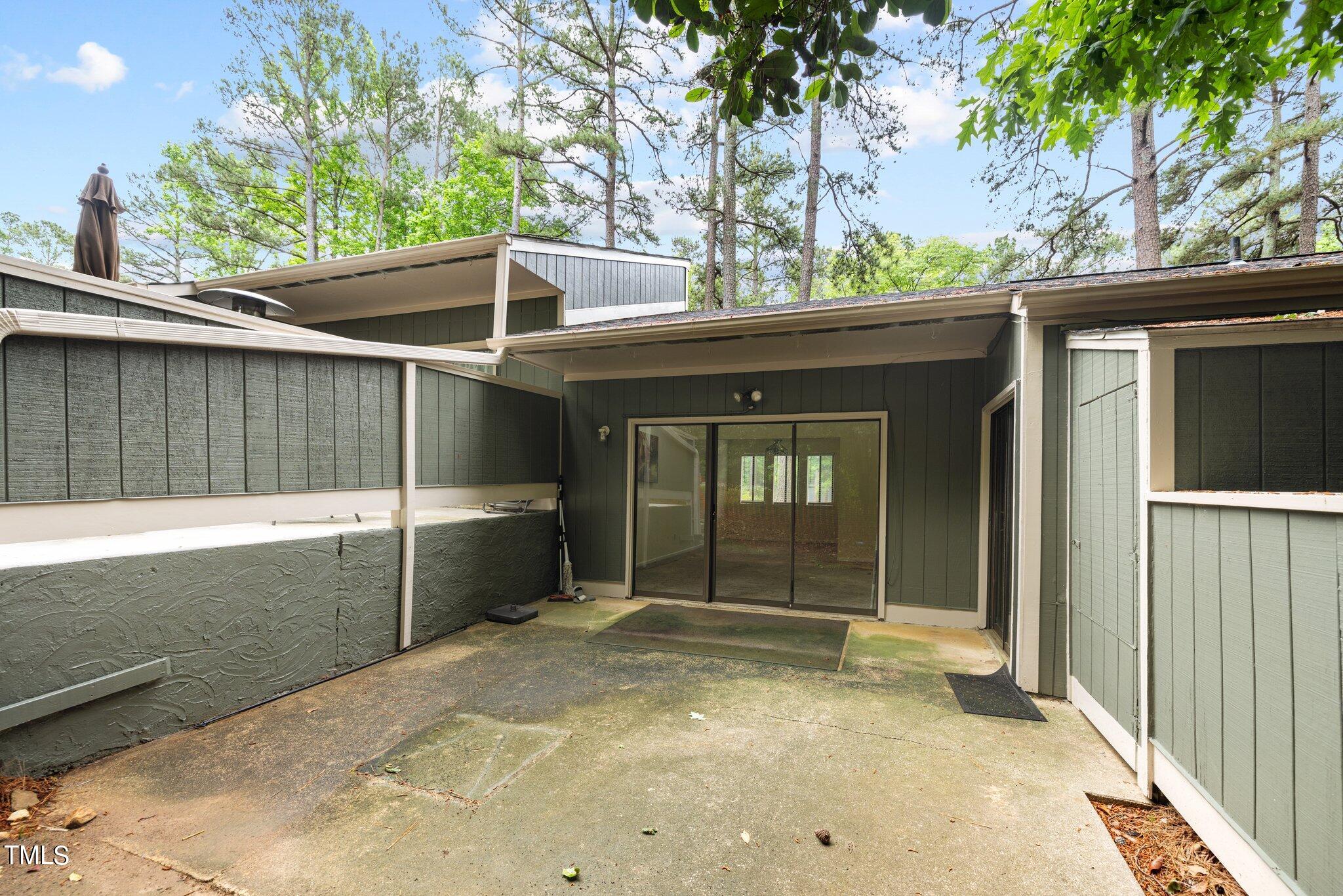 708 Godwin Court Raleigh, NC 27606 - Photo 13 of 48 a view of a house with a large window and wooden fence