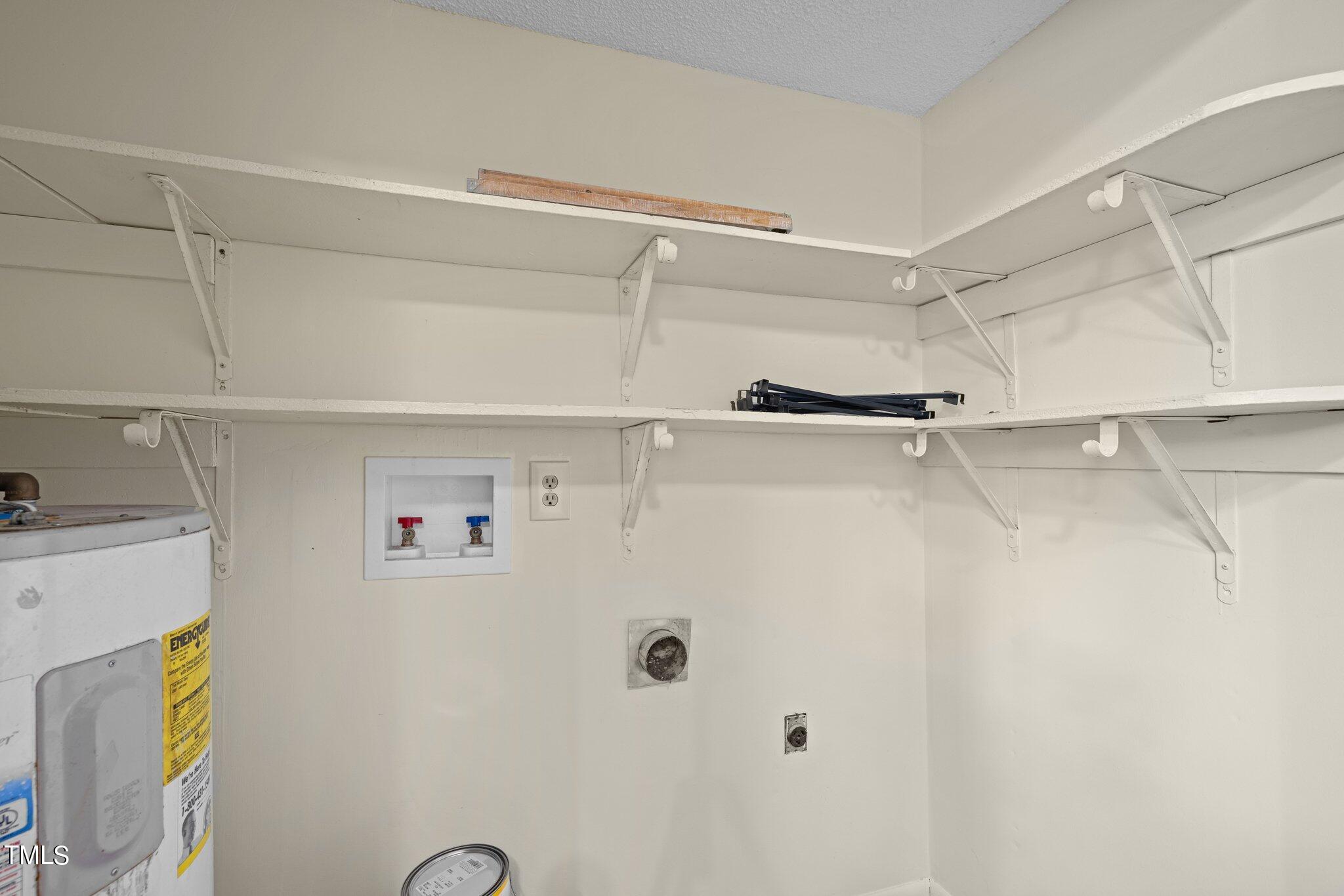 708 Godwin Court Raleigh, NC 27606 - Photo 14 of 48 a view of walk in closet with empty racks