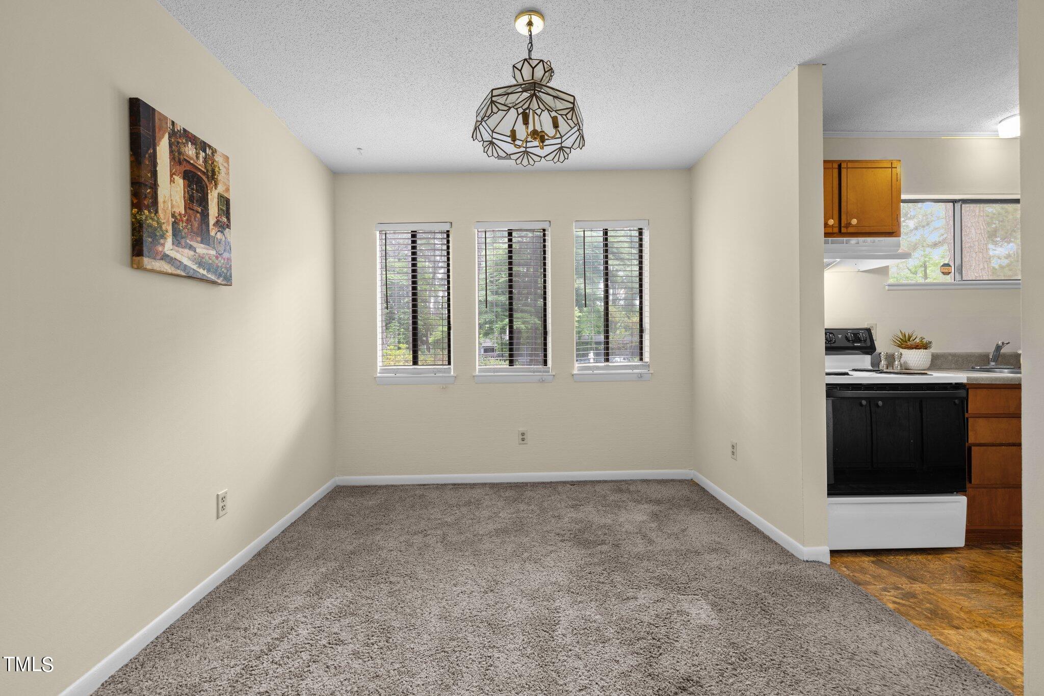 708 Godwin Court Raleigh, NC 27606 - Photo 21 of 48 a view of an empty room with a window