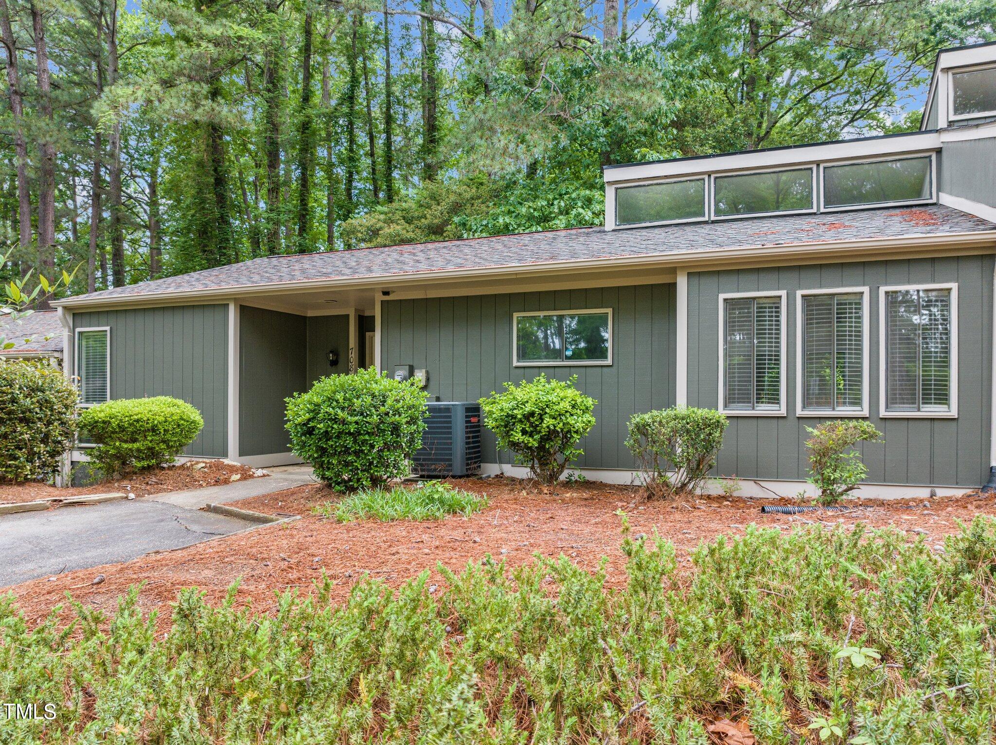 708 Godwin Court Raleigh, NC 27606 - Photo 3 of 48 a front view of a house with garden