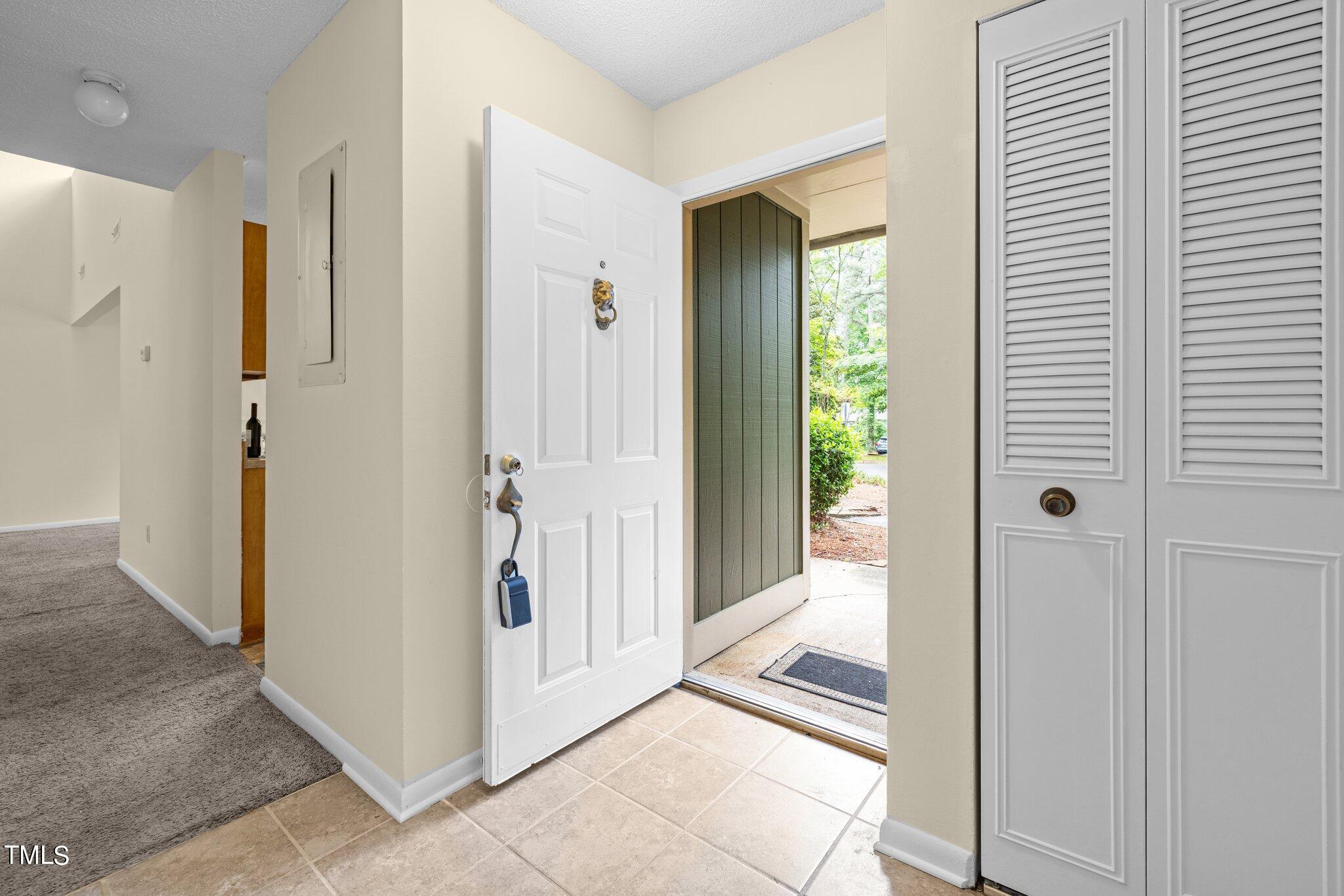 708 Godwin Court Raleigh, NC 27606 - Photo 38 of 48 a view of a hallway and closet with furniture