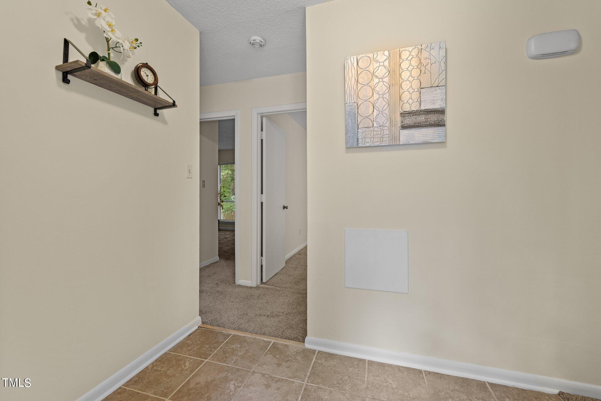 708 Godwin Court Raleigh, NC 27606 - Photo 39 of 48 a view of a room with rack on the wall and a window