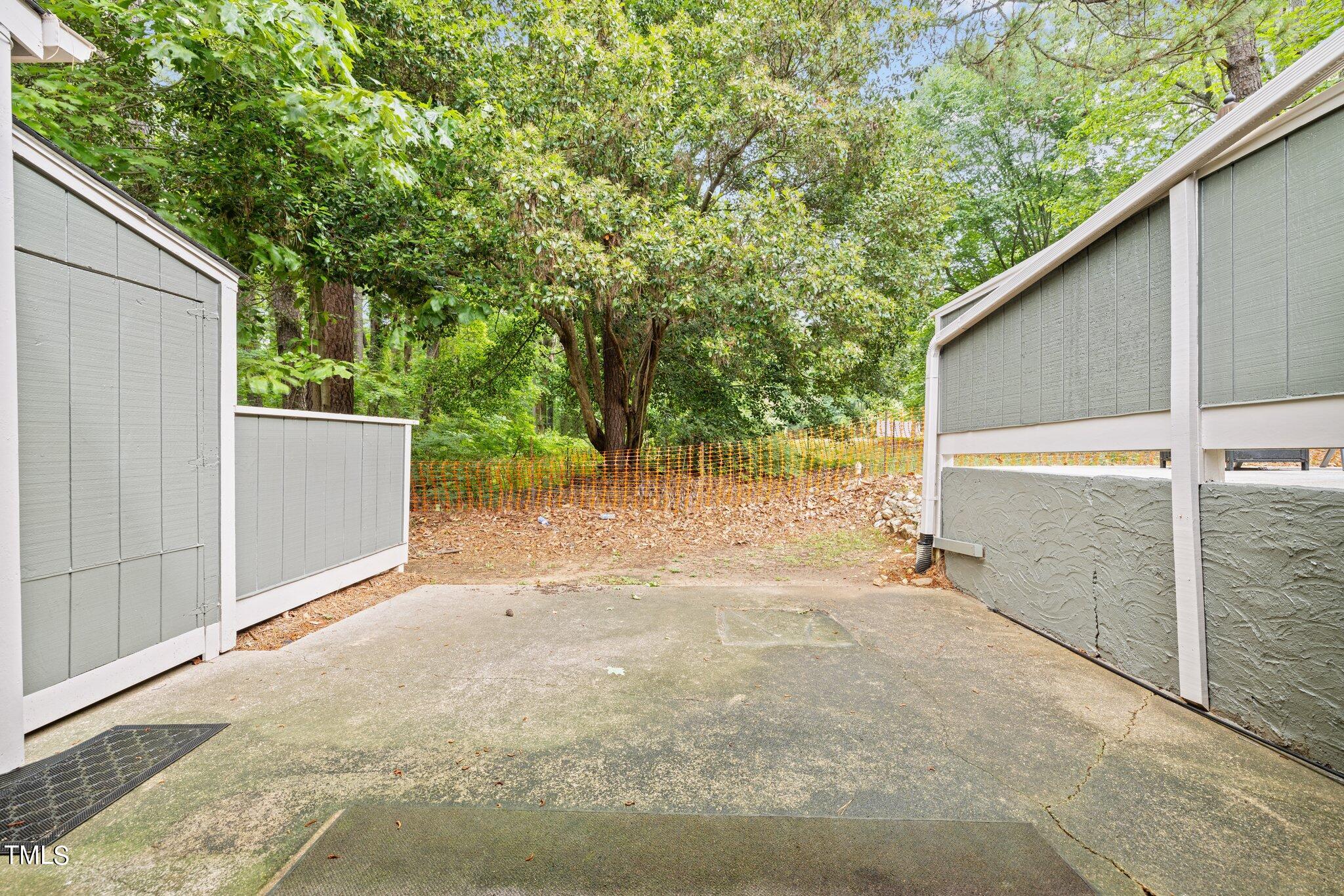 708 Godwin Court Raleigh, NC 27606 - Photo 45 of 48 a backyard of a house with lots of green space