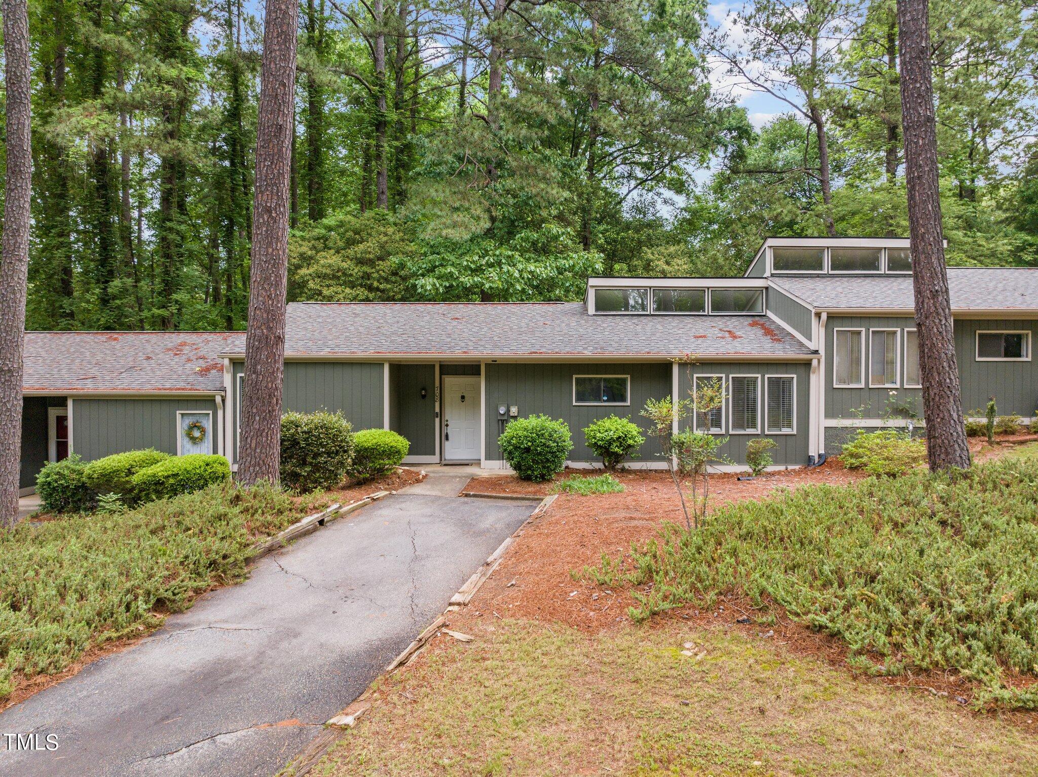 708 Godwin Court Raleigh, NC 27606 - Photo 6 of 48 a front view of a house with yard porch and furniture