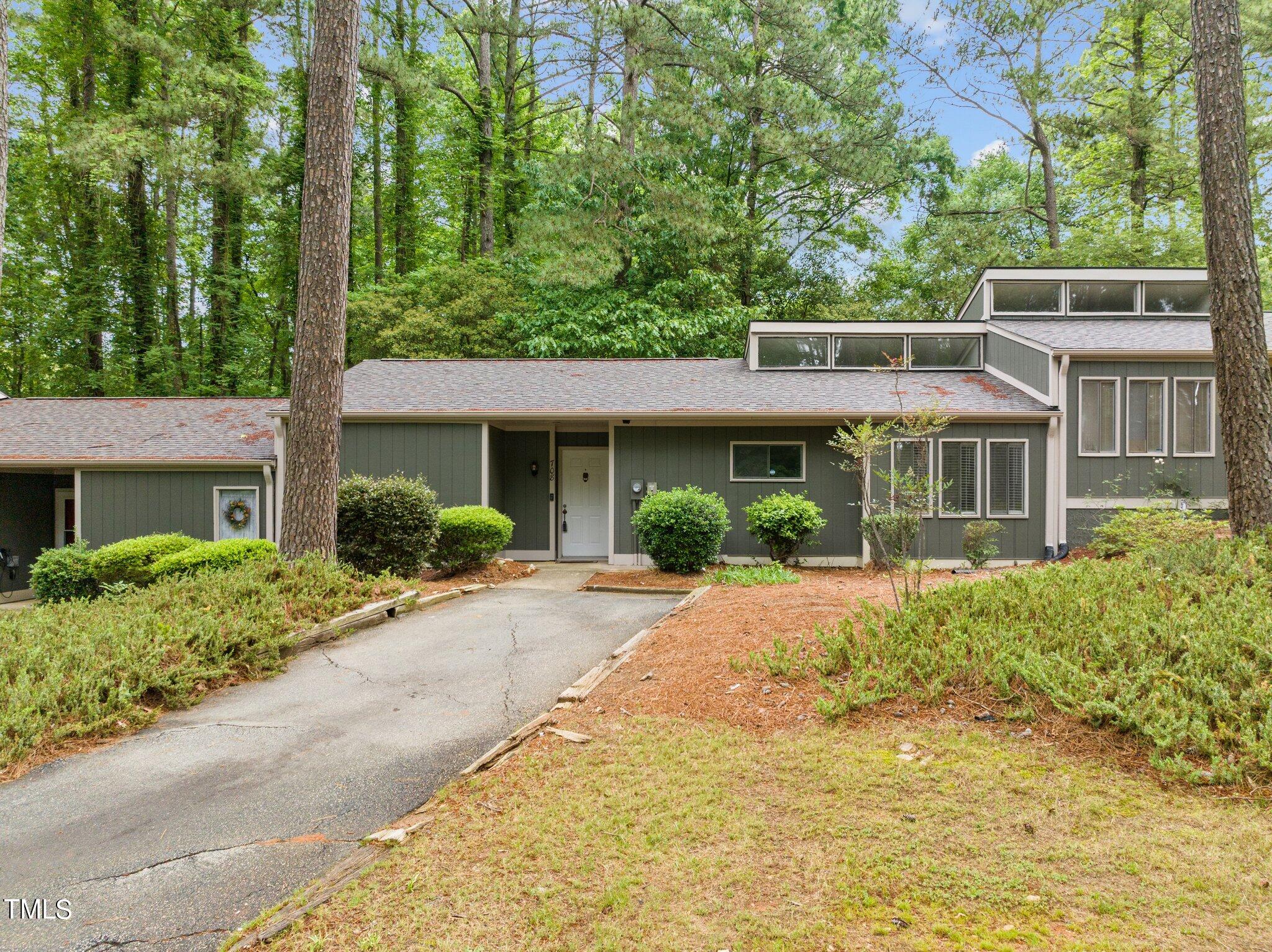 708 Godwin Court Raleigh, NC 27606 - Photo 8 of 48 a front view of a house with a garden