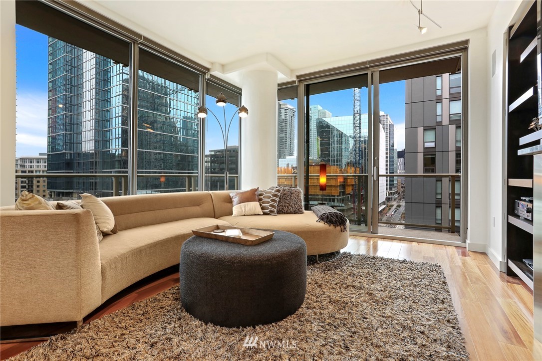 910 Lenora Street, Unit S1203 Seattle, WA 98121 - Photo 12 of 39 a living room with furniture and a large window