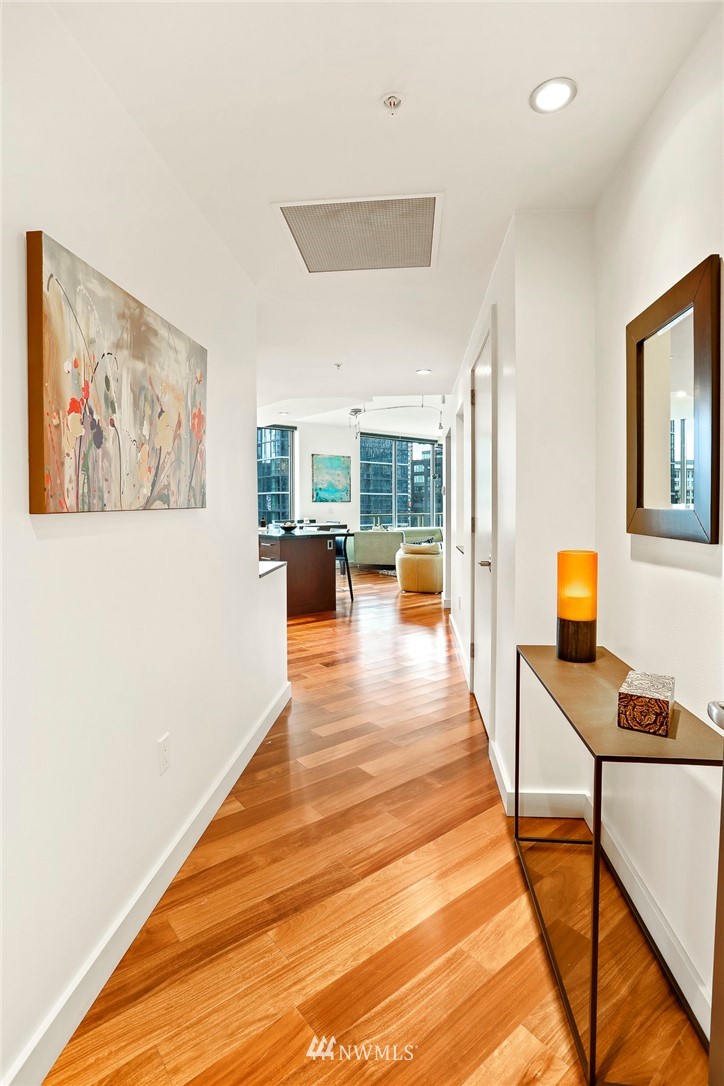 910 Lenora Street, Unit S1203 Seattle, WA 98121 - Photo 4 of 39 a view of a livingroom with workspace and a couch