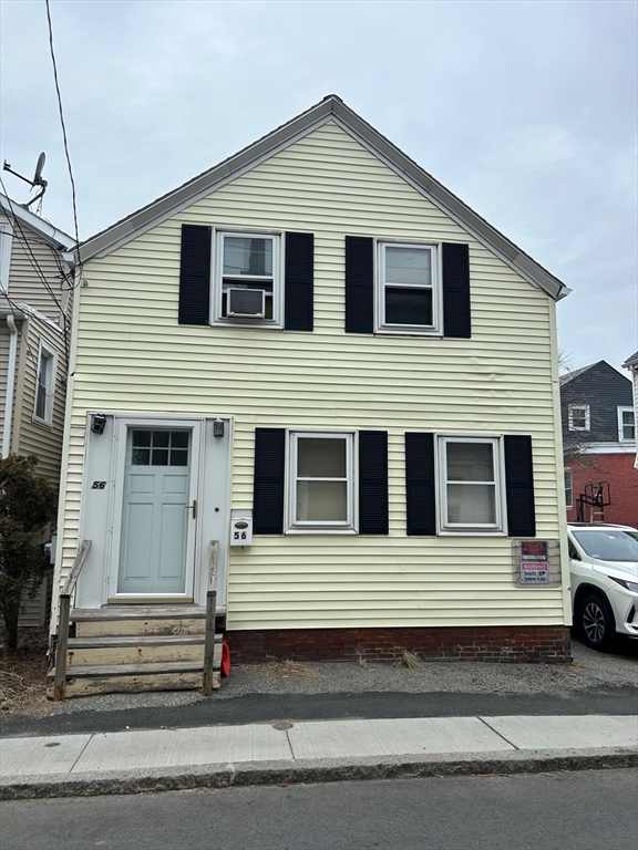 56 Cherry Street Chelsea, MA 02150 - Photo 2 of 10 a view of a house with a car parked front of it