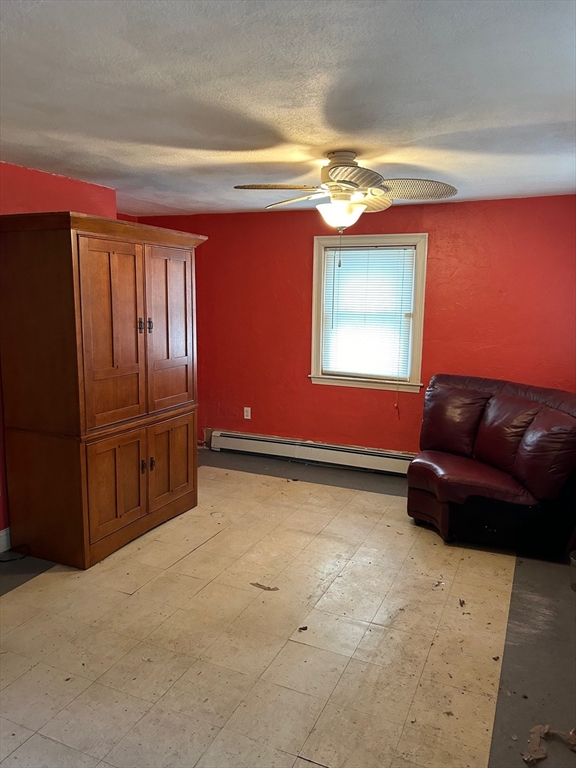 56 Cherry Street Chelsea, MA 02150 - Photo 3 of 10 a living room with furniture