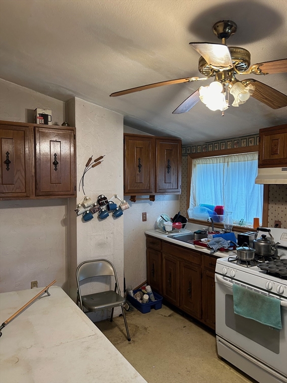 56 Cherry Street Chelsea, MA 02150 - Photo 5 of 10 a kitchen with a sink appliances and cabinets