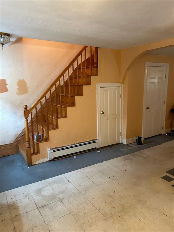 56 Cherry Street Chelsea, MA 02150 - Photo 8 of 10 a view of entryway with wooden floor