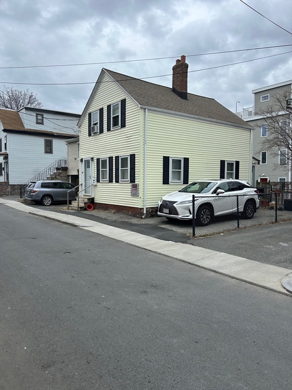 56 Cherry Street Chelsea, MA 02150 - Photo 10 of 10 a street view with couple of cars parked on road