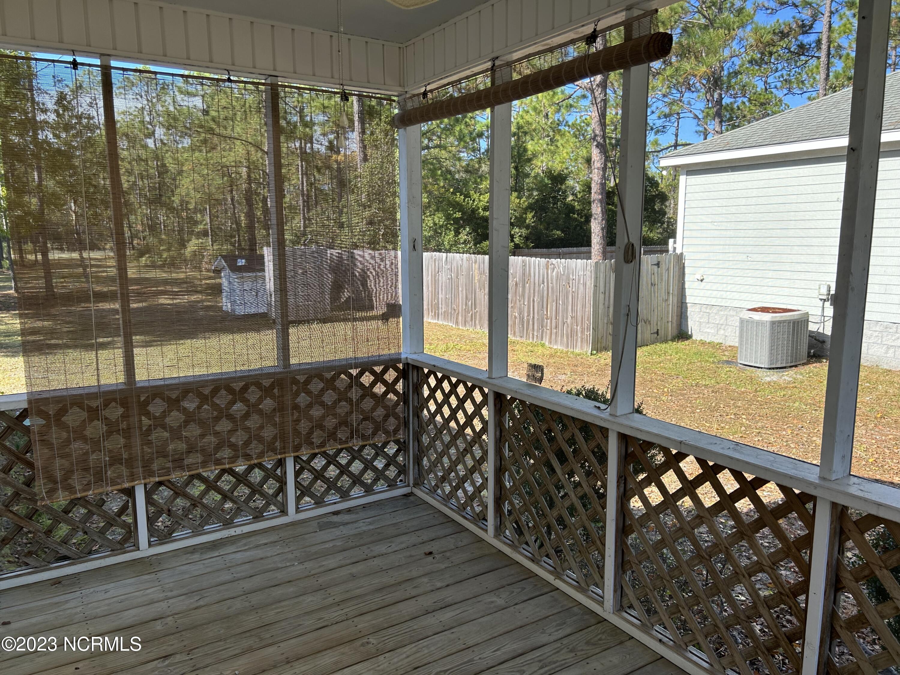 48 Burton Road Boiling Spring Lakes, NC 28461 - Photo 5 of 19 Screened Porch 2