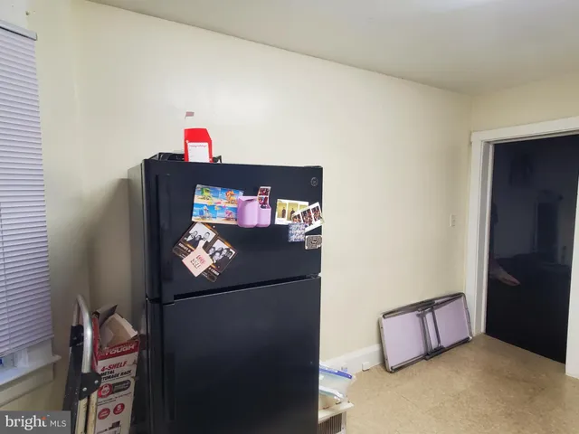 a refrigerator freezer sitting in a kitchen