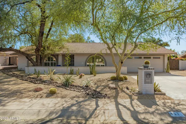 a view of a house with snow on the road