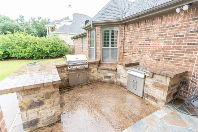 a view of a patio with couches chairs and potted plants