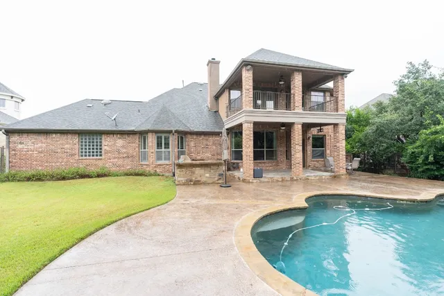 a front view of a house with swimming pool
