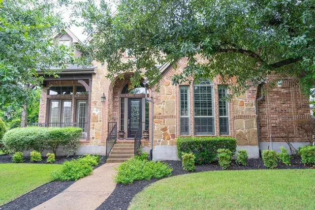 front view of a house with a yard